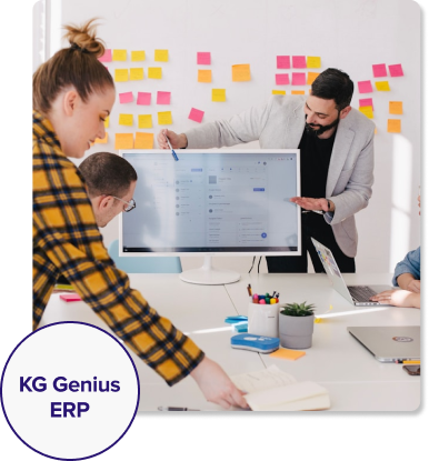 Diverse team collaborating on computers, utilizing Genius ERP for real-time insights and streamlined processes.